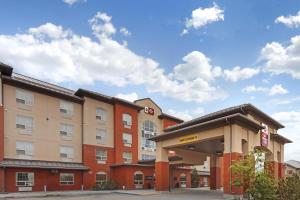 a hotel building with a gas station in front of it at Best Western Plus Meridian in Lloydminster