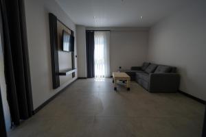 a living room with a couch and a table at Demederon Hotel in Hamsikoy +28 photos