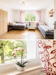 a living room with two beds and a window at Ferienwohnung Sonnendeck einladend und freundlich in Laupheim