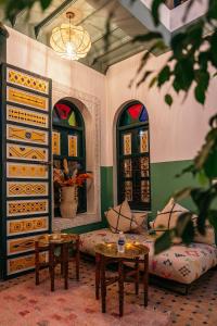 a living room with a couch and a table at The Little Hara in Marrakesh