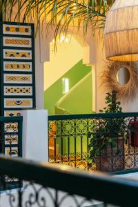 a balcony with a fence and a stairway at The Little Hara in Marrakesh