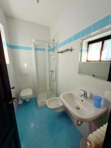 a bathroom with a sink and a shower at Casa Mario Spacious Garden Apartments, Lake Como in Domaso +22 photos