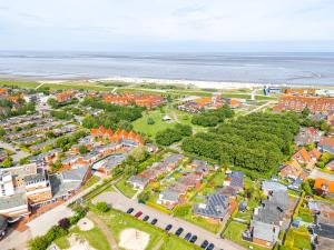 an aerial view of a town near the ocean at Bungalow Hohes Riff in Norddeich