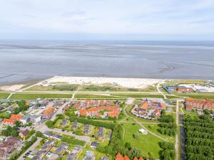 an aerial view of a resort near the beach at Bungalow Windstille in Norddeich