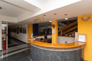 a lobby with a wooden counter in a building at Hotel Ferijalac in Sarajevo