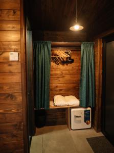 a small room with a bed and a window at Porto Gumati in Kutaisi