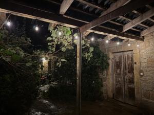 an outdoor room with a door and lights at Chlum 1 in Chlum