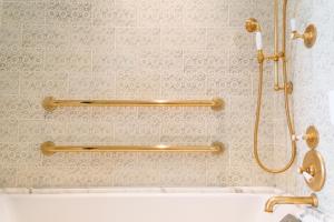 a bathroom with a shower and a bath tub at Hotel Per La, Autograph Collection in Los Angeles