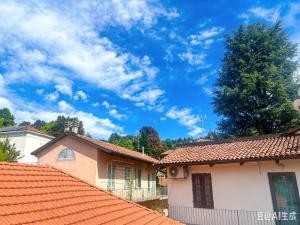 a house with orange roofs and a blue sky at Casaxxvaprile in Turin +23 photos