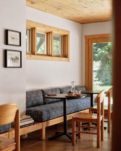 a living room with a couch and a table at The Alpine House in Jackson