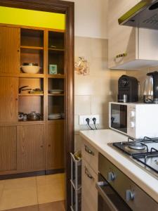 a kitchen with a stove and a stove top oven at DaMaHouse in Monastir +22 photos
