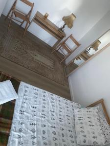 a bedroom with a bed with a chandelier above it at Campe Good in Waterloo