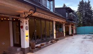a building with lights on the side of it at Ateliér Kráľovič in Hokovce