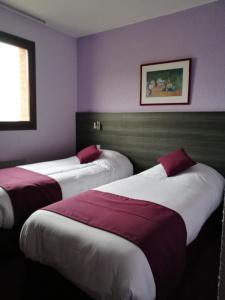 Säng eller sängar i ett rum på Lys Hôtel