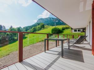a balcony with a table and chairs on it at Apartment Pegasus by Salzkammergood Living in Tauplitz
