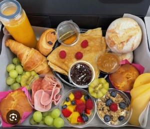 a lunch box filled with different types of food at Hi bed & breakfast Liège in Liège