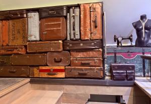a stack of suitcases stacked on top of each other at Ateliér Kráľovič in Hokovce +85 photos