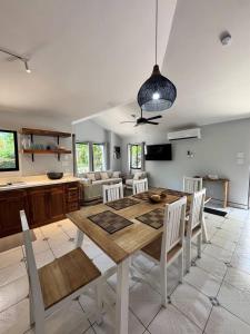 a kitchen and dining room with a table and chairs at Private 2 Bedroom Home with Pool Near El Coco Beach in Coco