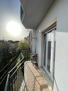 a balcony of a building with a view of a city at Happy Oasi in Lido Adriano