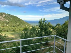 a view of the mountains from the porch of a house at Apartman Selišta in Danilovgrad