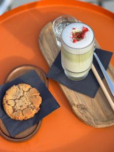 a plate with a cupcake and a cookie on it at Penzión ZAYDA in Výrava