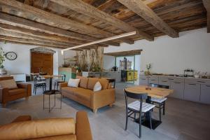 a living room with a couch and a table at Posestvo Pri žabi in Štanjel
