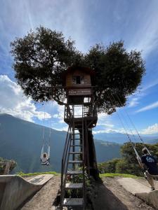 a tree house on the side of a mountain at Riverside Estate with Jacuzzi 9 Bedroom 7 Bath in Baños