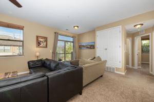 a living room with a couch and a window at Timbers 9-4 in Fraser