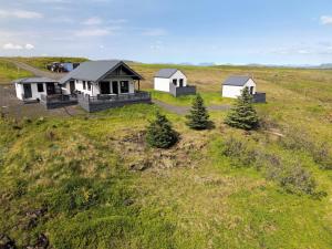 an overhead view of three houses in a field at Akrar guesthouse in Hella