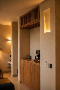 a kitchen with a counter with a coffee maker at Olivo Mio in La Paz