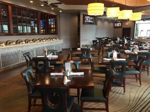 a dining room filled with tables and chairs at Town & Country Inn and Suites in Charleston