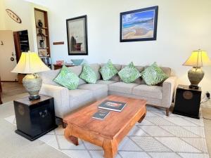 a living room with a couch and a coffee table at Best Ocean and Mountain View! in Waikoloa Village