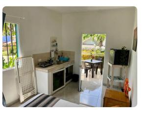 a kitchen with a stove and a dining room with a table at Puravida # 1 in Colorado