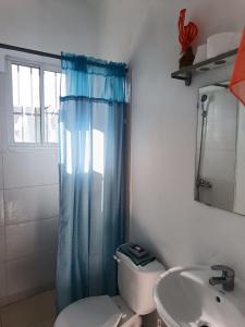 a bathroom with a toilet and a sink and a mirror at Puravida # 1 in Colorado +23 photos