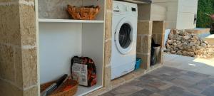 a white washer and dryer in a kitchen at Chalet Gallipoli in Gallipoli