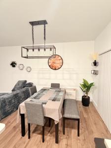 a dining room with a table and chairs at Casa Lux in Florida City