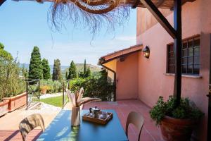 a blue table and chairs on a patio at Agriturismo Pimpinnacolo in Porto Ercole