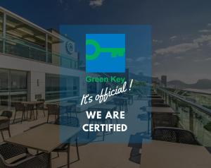 a sign that says green key its official we are certified at Arena Copacabana Hotel in Rio de Janeiro