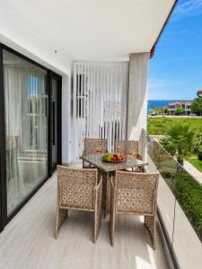 a dining room with a table and chairs on a balcony at Amore Fanari in Fanari