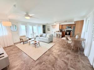 a living room with a couch and a table at Kona Kai Ocean View Suite in Kailua-Kona