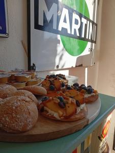 a table topped with donuts and pastries on a table at Al vecchio Incasato in Grottammare +25 photos