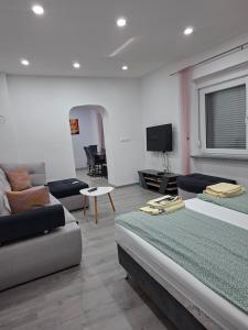 a living room with two beds and a couch at Apartman Edwin Jajce in Jajce