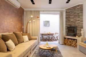a living room with a couch and a fireplace at Island Breeze Oasis by Belmont Realty in Vela Luka