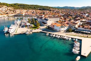 an aerial view of a harbor with boats in the water at Island Breeze Oasis by Belmont Realty in Vela Luka