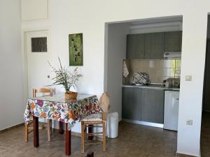 a kitchen with a table with a table cloth on it at Zourpos Studios in Kalyves