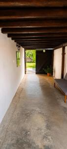 an empty garage with a bench and a gate at Klidná Chalupa in Bulhary