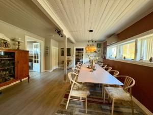 a dining room with a table and chairs at Fornes Bed & Breakfast in Fornes +17 photos