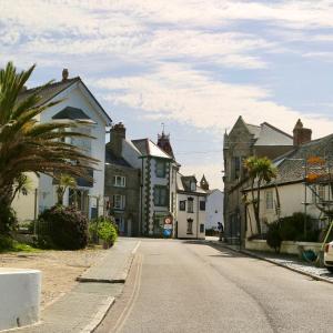 an empty street in a small town with houses at St Michaels Reach Guest House in Marazion
