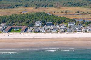 an aerial view of a beach with houses and the ocean at Little Miss Cottages - Studio in Old Orchard Beach +16 photos