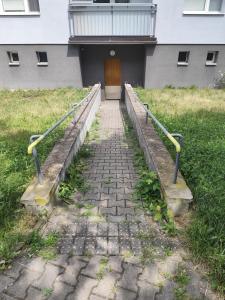 a stone staircase leading to a building with a door at Apartman Elizabeth in Pardubice